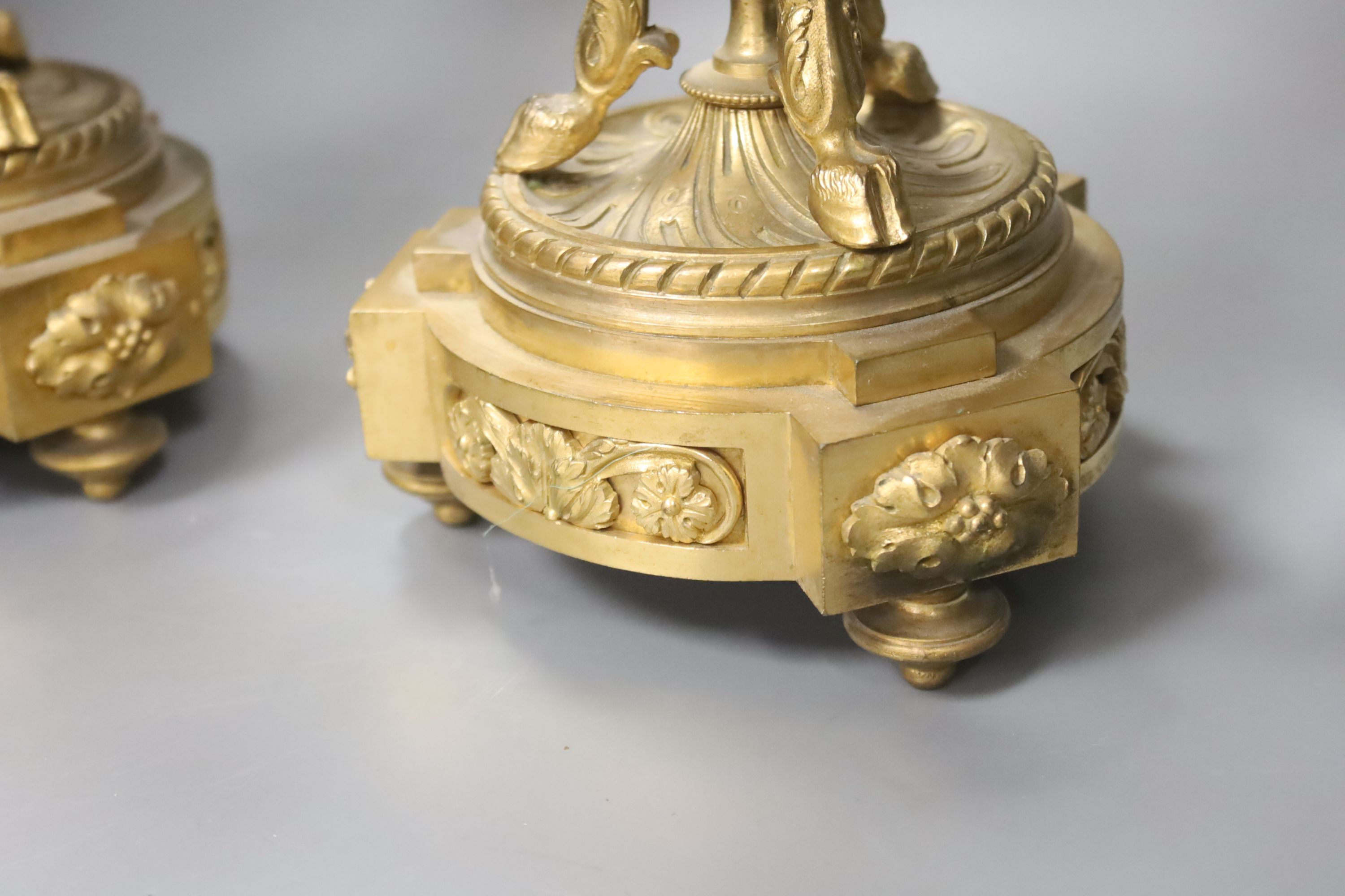 A pair of ormolu three branch candelabra